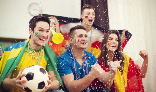 images/multinational-football-supporters-celebrating-goal.jpg